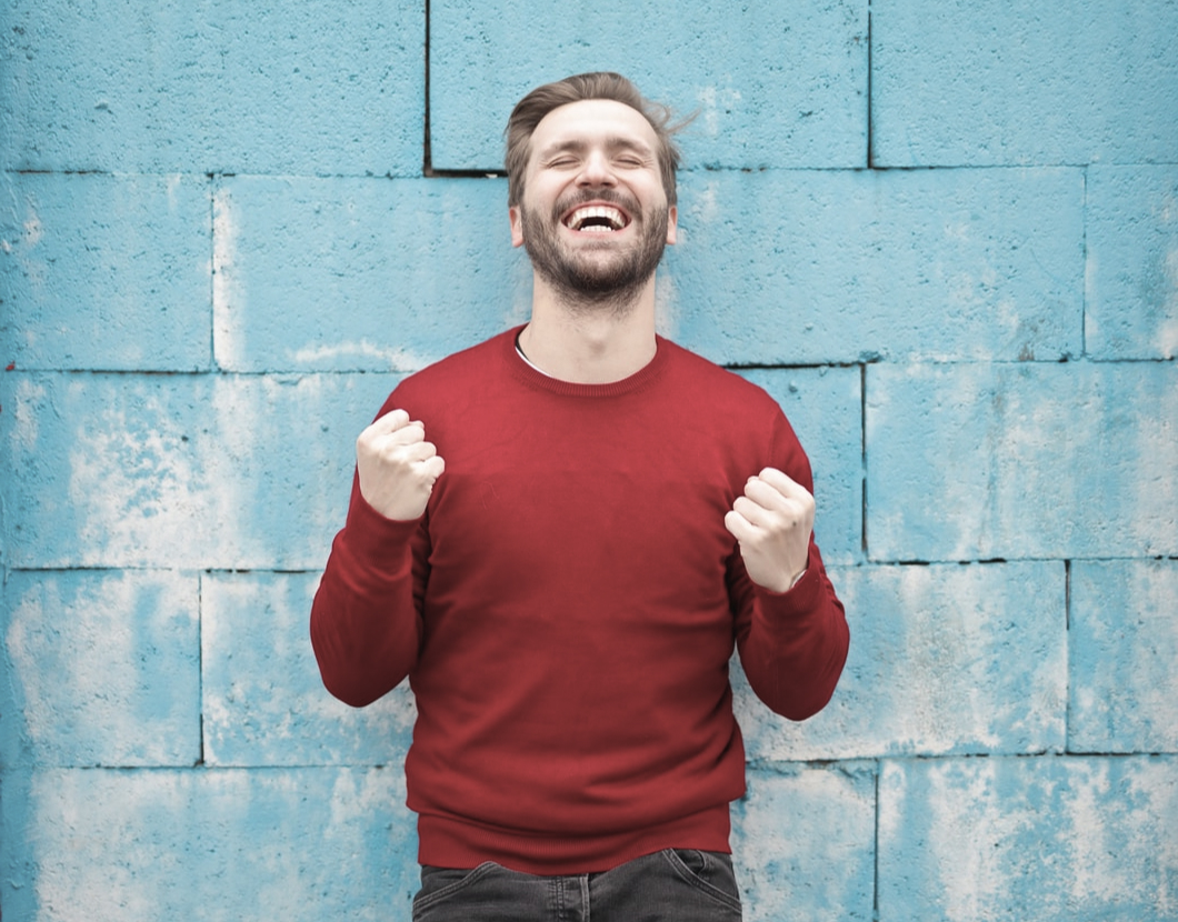 A man smiling enthustiastically