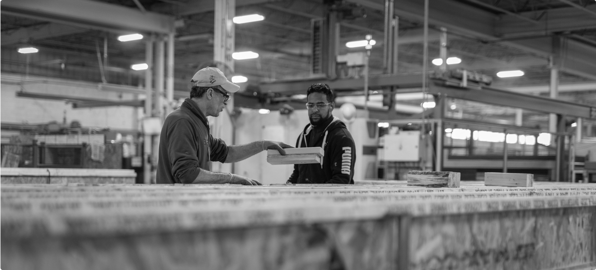 Two Home Technology warehouse associates discuss their next task.